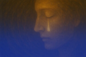 Träne auf der Wange als Ausdruck emotionaler Belastung, Trauma und seelischem Schmerz.